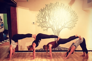 four people yoga poses